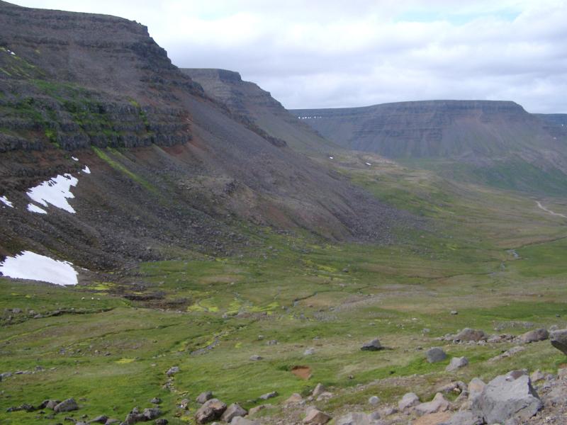 Attractive Hills and Landscape at Iceland Country on Very Light Blue Sky Background.
